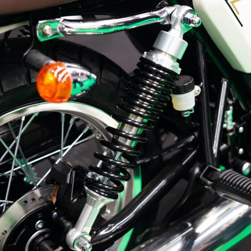 Detail of the suspension on the rear wheel of a custom motorbike